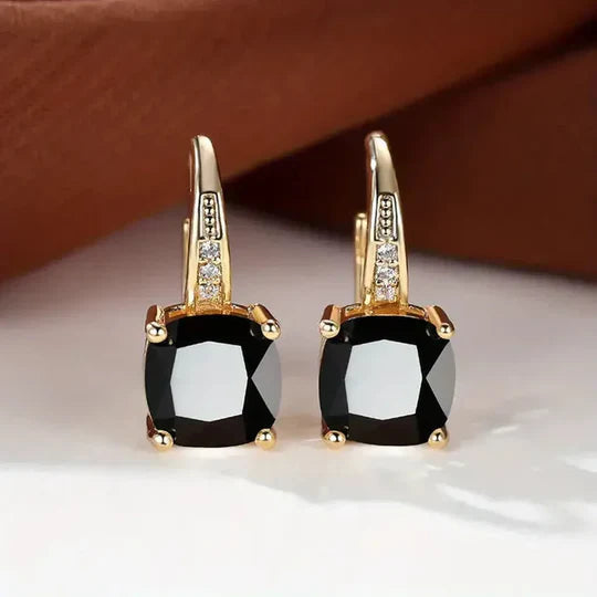 Gold hoop Earrings with mystery Stones.