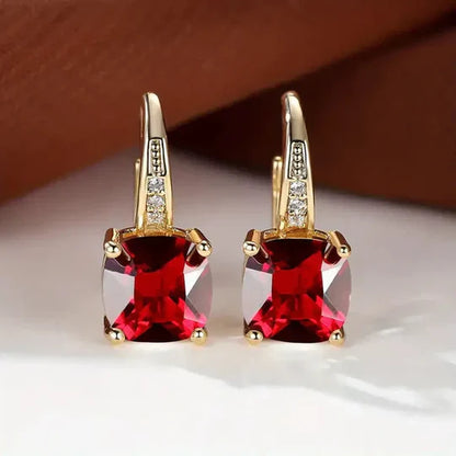 Gold hoop Earrings with mystery Stones.