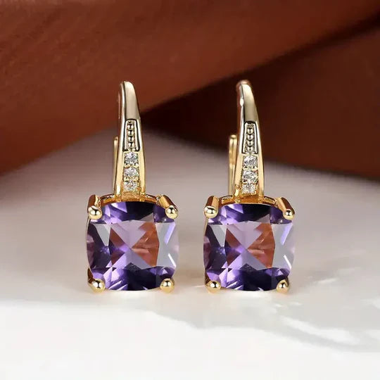 Gold hoop Earrings with mystery Stones.