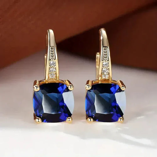 Gold hoop Earrings with mystery Stones.