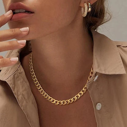 Cuban necklace with thick gold chains.