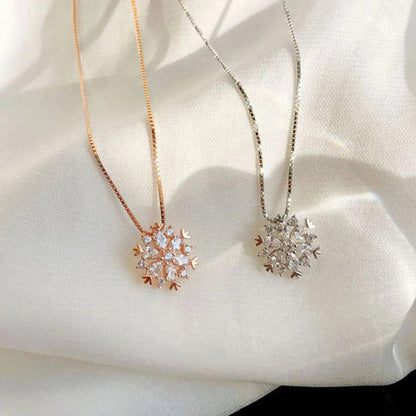 Crystal necklace with sparkling snow in gold and silver.