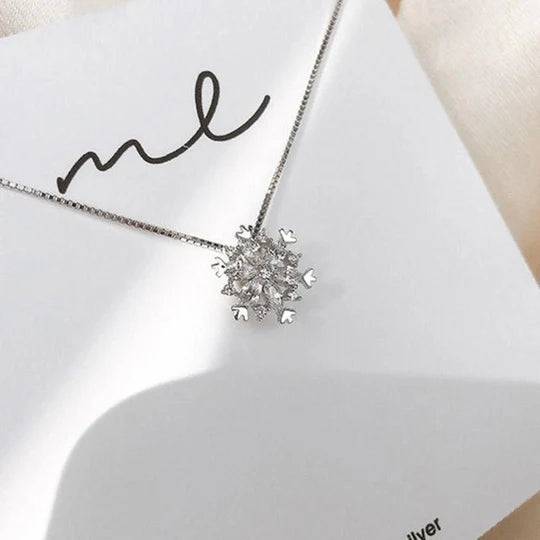 Crystal necklace with sparkling snow in gold and silver.