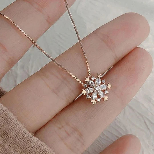 Crystal necklace with sparkling snow in gold and silver.