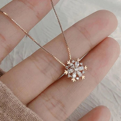 Crystal necklace with sparkling snow in gold and silver.