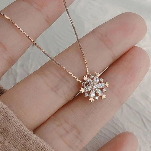 Crystal necklace with sparkling snow in gold and silver.