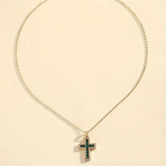 Gold necklace with emerald cross