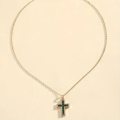 Gold necklace with emerald cross