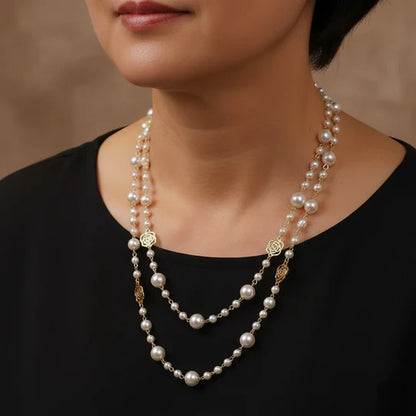 Elegant gold necklace with a small pearl.