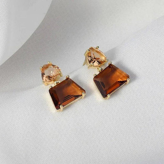 Desert crystal earrings in Gold.