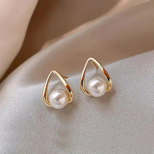 Elegant triangular earrings with pearls.