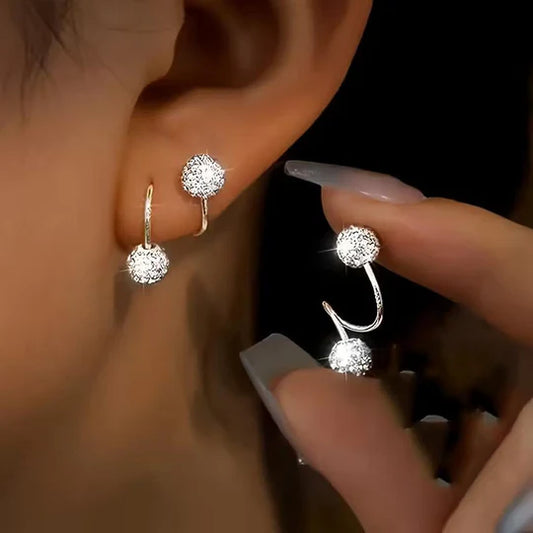 Set of lightweight and luxurious earrings with spiral beads and rhinestones.