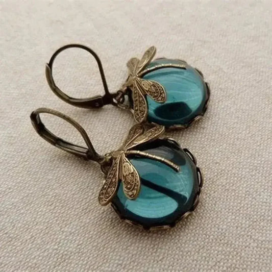 Ball earrings with dragonfly in antique gold.